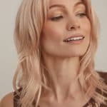 Blonde wavy wig with side parting from Hidden Secrets Wigs.